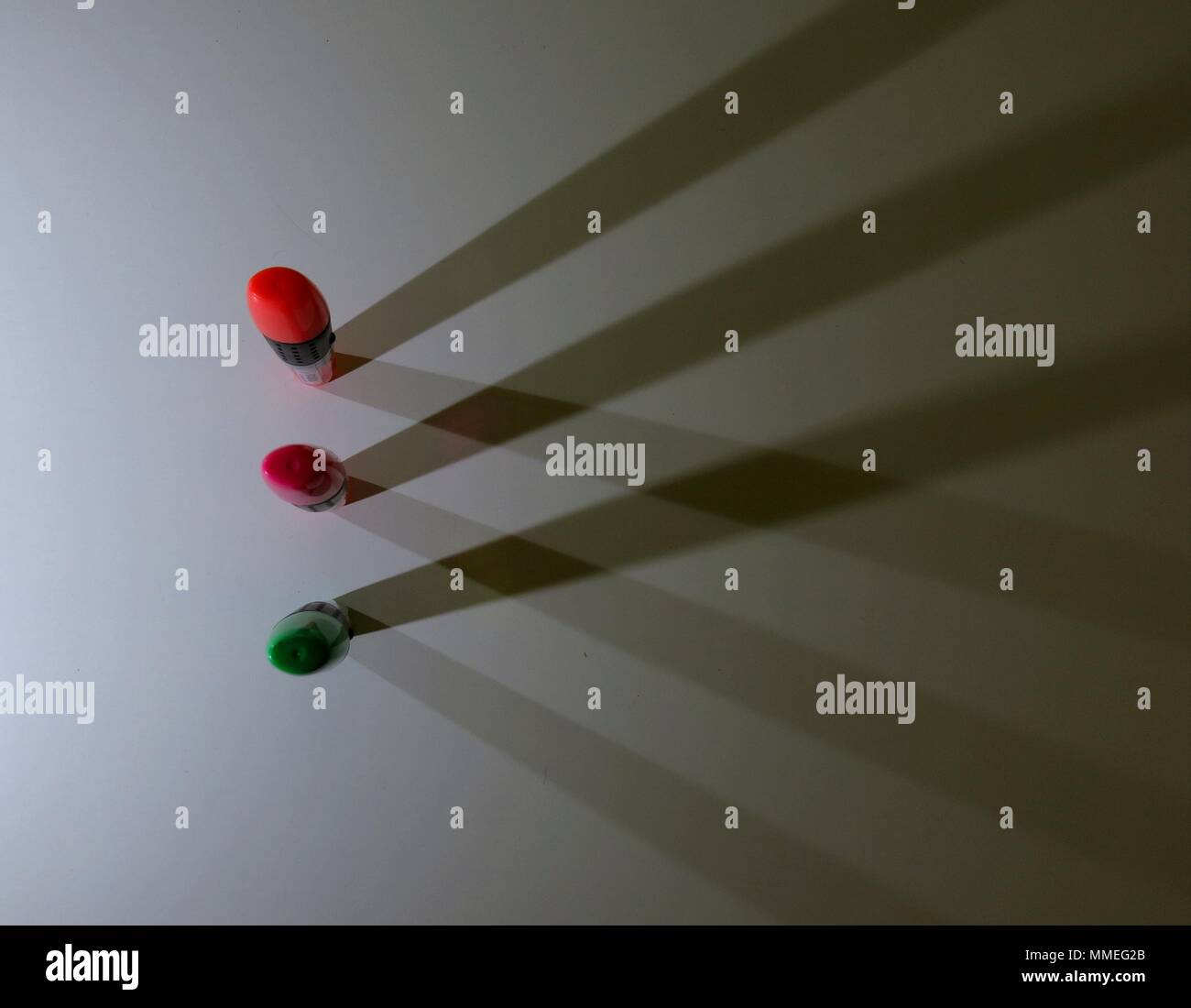 Highlighters casting shadows on white background. Stock Photo