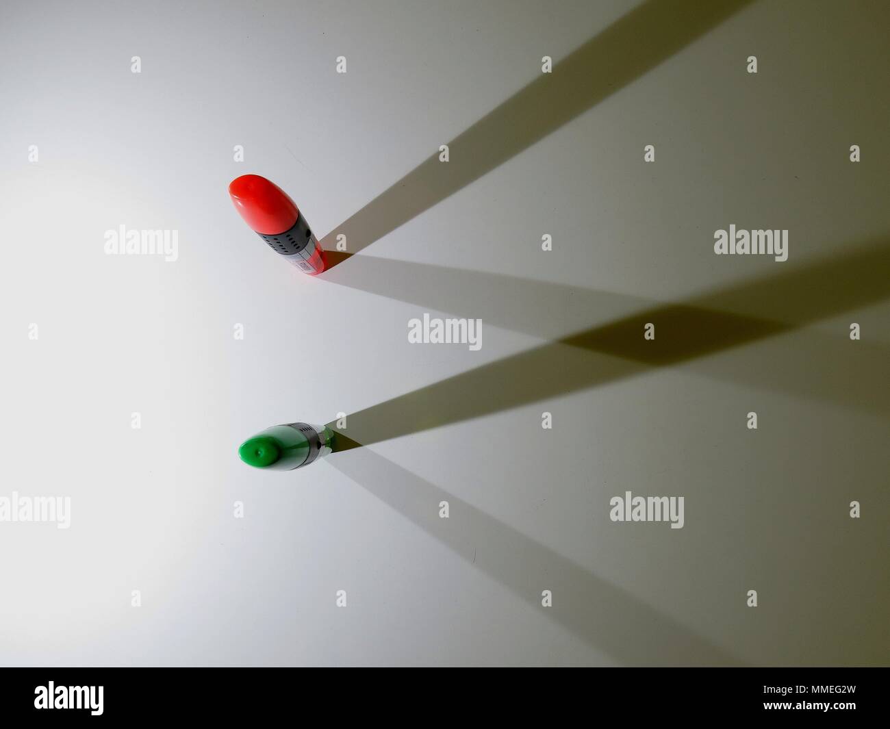 Highlighters casting shadows on white background. Stock Photo