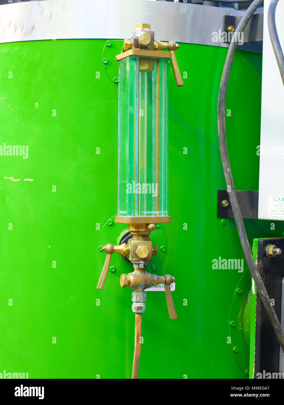 Removing and replacing the hand hole and gasket on a boiler Stock Photo