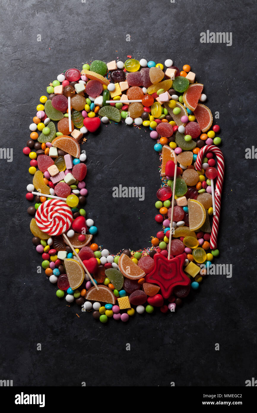 Number zero made from sweet candies on dark background. Greeting card ...