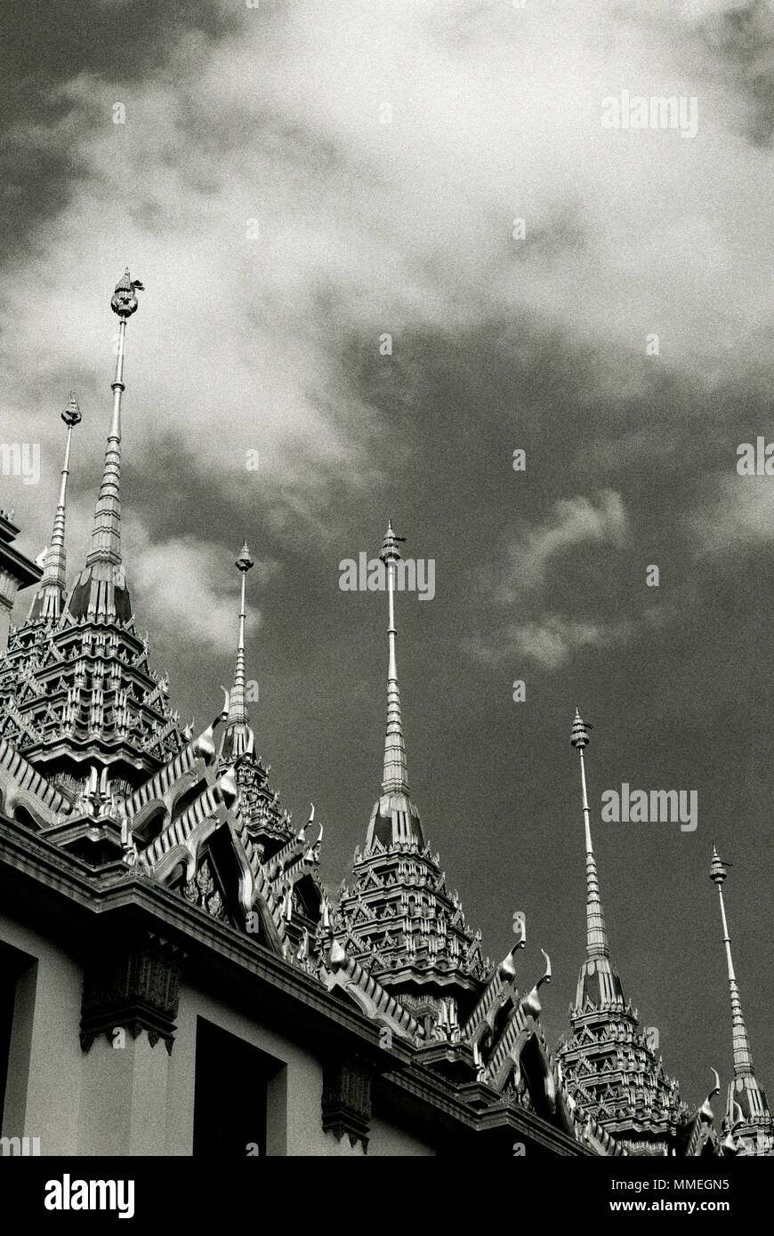Spires of the Buddhist temple Loha Prasat Metal Castle of Wat Ratchanadda in Bangkok in Thailand in Southeast Asia Far East. Architecture Travel B&W Stock Photo