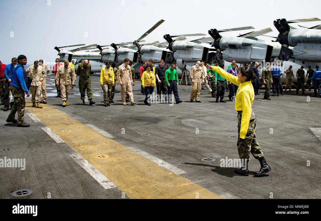 180510-N-ZK016-0020 U.S. 5TH FLEET AREA OF OPERATIONS (May 10, 2018) Sailors and Marines conduct a foreign object damage walk-down on the flight deck of the Wasp-class amphibious assault ship USS Iwo Jima (LHD 7), May 10, 2018, May 10, 2018. Iwo Jima, homeported in Mayport, Fla. is on deployment to the U.S. 5th Fleet area of operations in support of maritime security operations to reassure allies and partners, and preserve the freedom of navigation and the free flow of commerce in the region. (U.S. Navy photo by Mass Communication Specialist 3rd Class Joe J. Cardona Gonzalez /Released). () Stock Photo