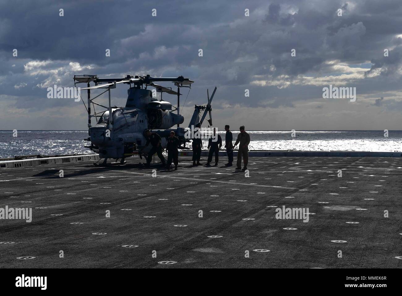 171025-N-BK384-020 MEDITERRANEAN SEA (Oct. 25, 2017) U.S. Marines prepare to conduct maintenance on an AH-1Z Viper attack helicopter, attached to Marine Medium Tiltrotor Squadron (VMM) 161 (reinforced) on the flight deck aboard the San Antonio-class amphibious transport dock ship USS San Diego (LPD 22) Oct. 25, 2017. San Diego is deployed with the America Amphibious Ready Group and the 15th Marine Expeditionary Unit to support maritime security and theater security cooperation in efforts in the U.S. 6th Fleet area of operations. (U.S. Navy photo by Mass Communication Specialist 3rd Class Justi Stock Photo