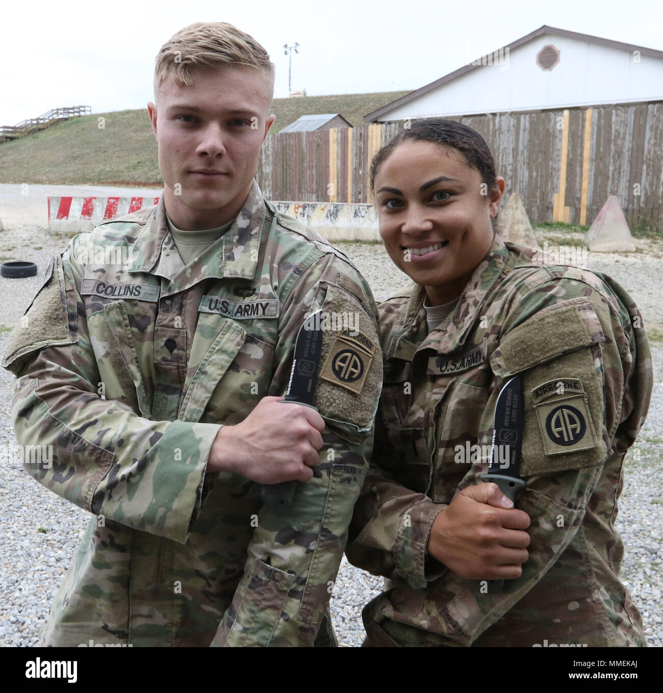 Spc. Elliot Collins and 1st Lt. Azura Lewis of the Liaison Monitoring Team out of Camp Bondsteel, Kosovo, pose with their combat knives awarded to them for winning the Bowie Challenge, September 28, 2017, at Camp Bondsteel, Kosovo. (U.S. Army photo by Staff Sgt. Nicholas Farina) Stock Photo