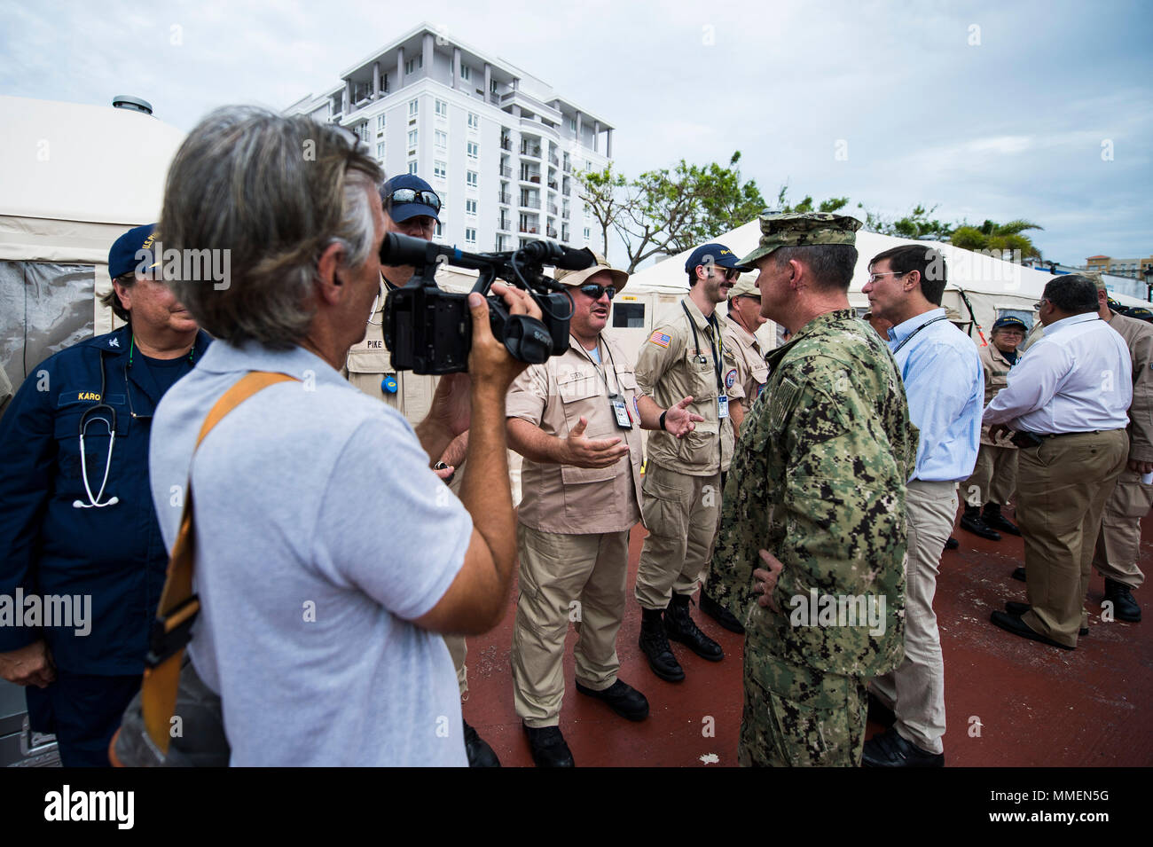 U.S. Navy Capt. Kevin Robinson, the USNS Comfort mission commander, speaks with a member of the Natural Disaster Medical System upon return to San Juan, Puerto Rico, Oct. 27, 2017. Comfort is part of the whole-of-government response effort and is assisting the Federal Emergency Management System (FEMA), the lead federal agency, in helping those affected by Hurricane Maria.  (U.S. Air Force photo by Tech. Sgt. Larry E. Reid Jr.) Stock Photo