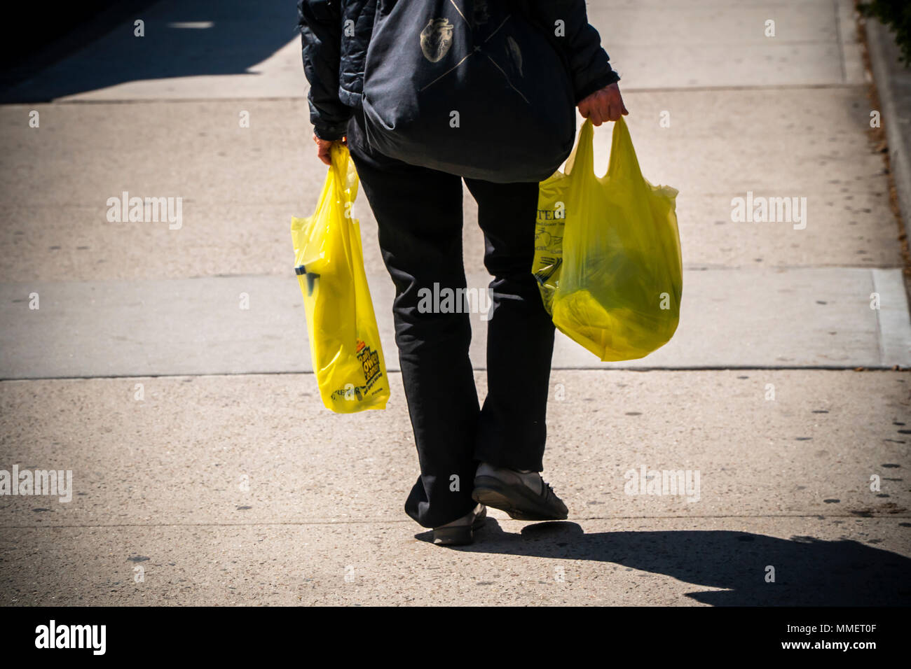 A shopper with her supermarket plastic bags in New York on Thursday, April 26, 2018. New York State Gov. Andrew Cuomo announced his intention to institute a statewide ban on single-use plastic bags, after previously opposing similar legislation proposed by New York City.  (Â© Richard B. Levine) Stock Photo