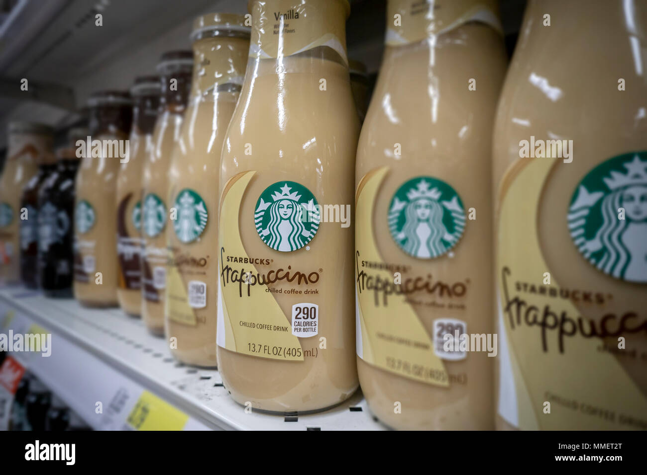 Bottles of Starbucks Frappuccino coffee are seen on a supermarket shelf in New York on Friday, May 4, 2018. NestlŽ is reported to be in talks to purchase Starbucks' grocery business. The units that sell beans and drinks in supermarkets and groceries are involved and not any of the stores. NestlŽ is the world's largest packaged food company. (© Richard B. Levine) Stock Photo