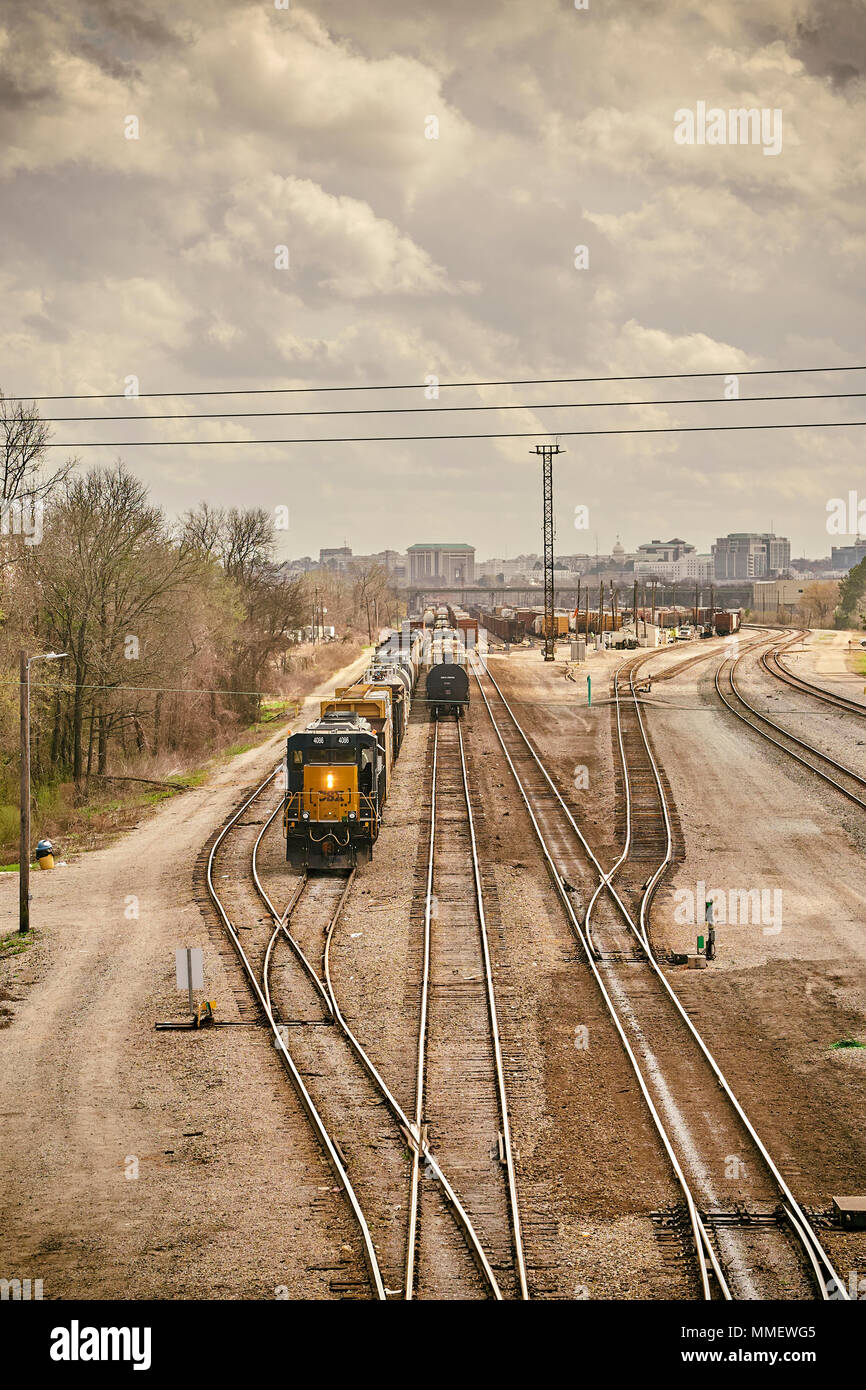 CSX Corporation train locomotive engine 4086 moving freight or rail cars in the switching yard of CSX Transportation in Montgomery Alabama, USA. Stock Photo