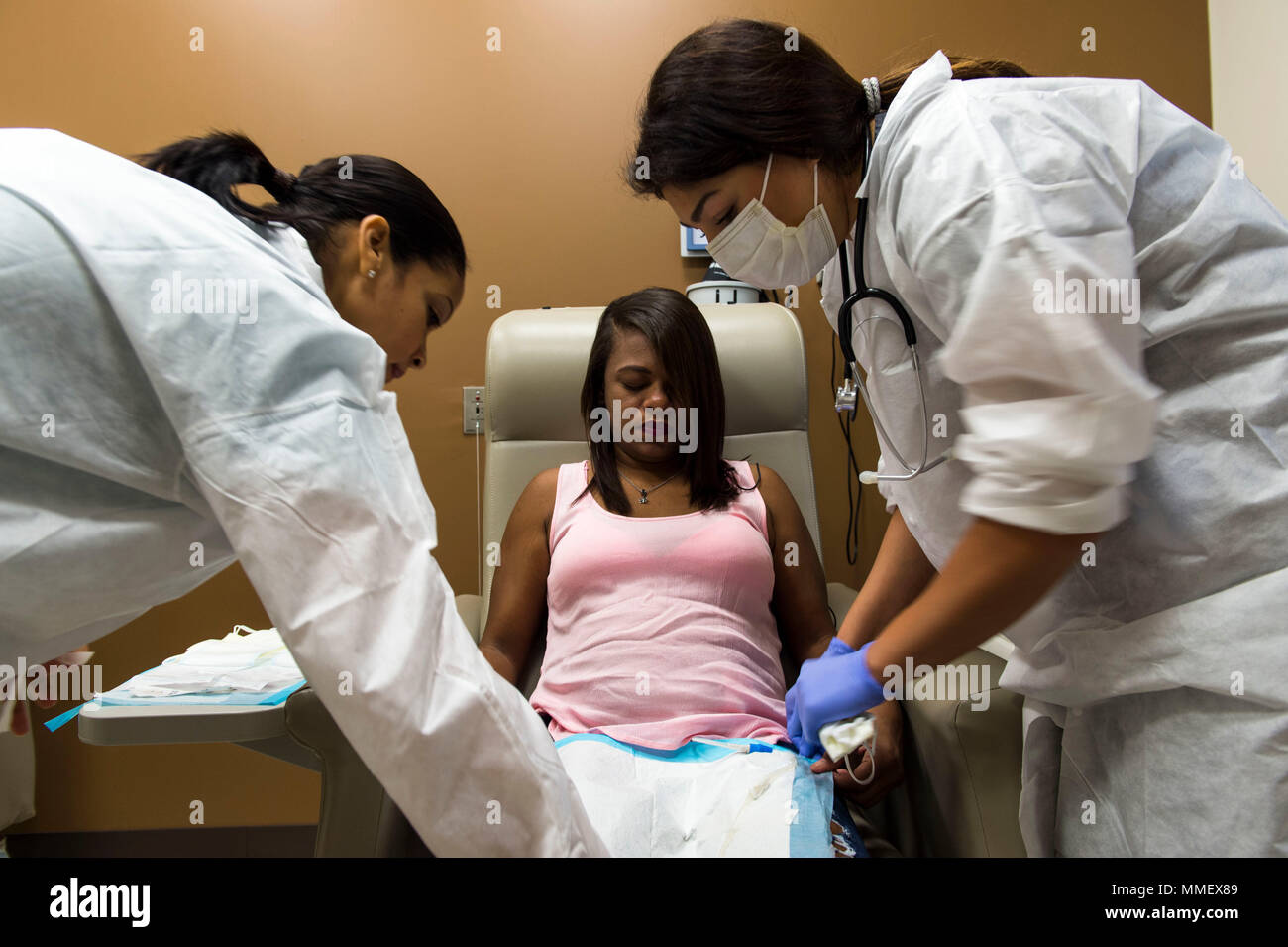 Jesenia Santos, a dialysis patient at Fresenius Medical Care is prepared  for her treatment by Nayeli Bustillos, a volunteer registered nurse, at  Vega Alta Puerto Rico, Oct. 31, 2017. Nearly 100 Fresenius