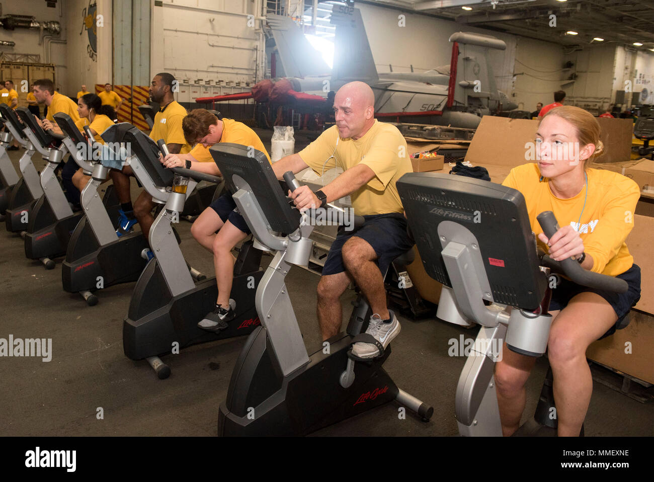 https://c8.alamy.com/comp/MMEXNE/171030-n-yn937-060-atlantic-ocean-oct-30-2017-sailors-ride-stationary-bikes-while-participating-in-the-physical-readiness-test-prt-in-the-hanger-bay-aboard-the-aircraft-carrier-uss-harry-s-truman-cvn-75-harry-s-truman-has-successfully-completed-tailored-shipboard-test-availability-and-final-evaluation-problem-and-is-underway-preparing-for-future-operations-us-navy-photo-by-mass-communication-specialist-3rd-class-alan-lewisreleased-MMEXNE.jpg
