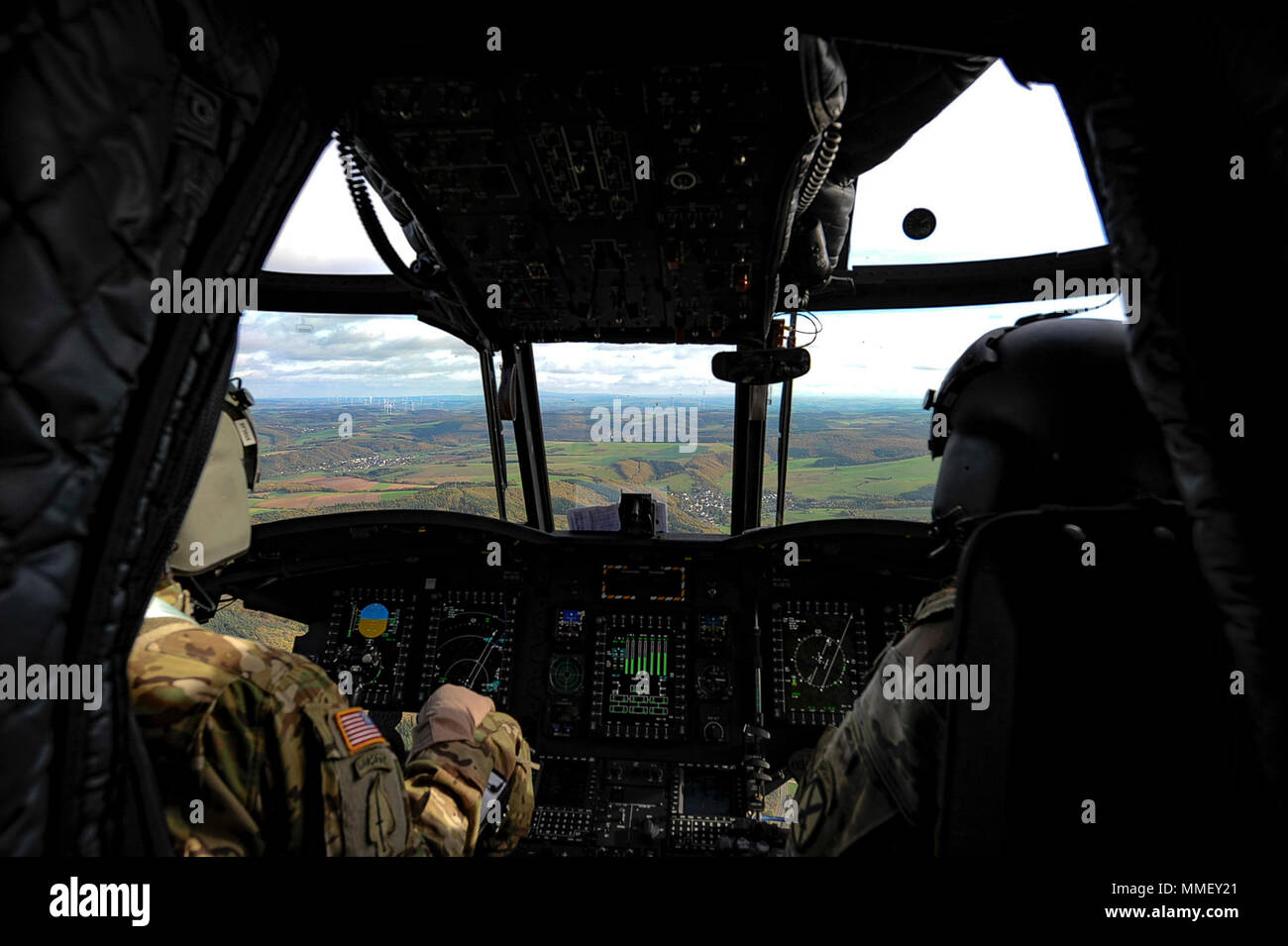 U.S. Army Chief Warrant Officer 2 Jacob Stolar, left, and Chief Warrant  Officer 3 Amanda Gard, right, 1st Air Calvary Brigade pilots, fly a CH-47F  Chinook from Chièvres Air Base, Belgium, to