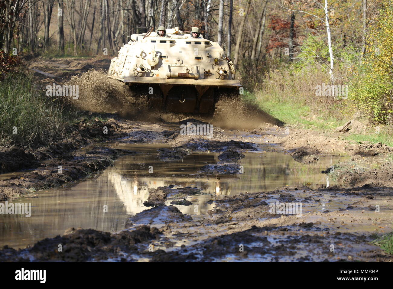 M88A1 Medium-Tracked Recovery Vehicle is an armored recovery vehicle developed for the United States Army to tow and repair disabled tracked vehicles, powered by a Continental AVDS-1790 diesel engine and equipped with a main winch rated at 60,000 pounds. On Oct. 20, 2017, it is driven during the Regional Training Site Maintenance Tracked-Vehicle Recovery Course at Fort McCoy, Wisconsin. The archival image documents hands-on vehicle recovery training on North Post. Stock Photo