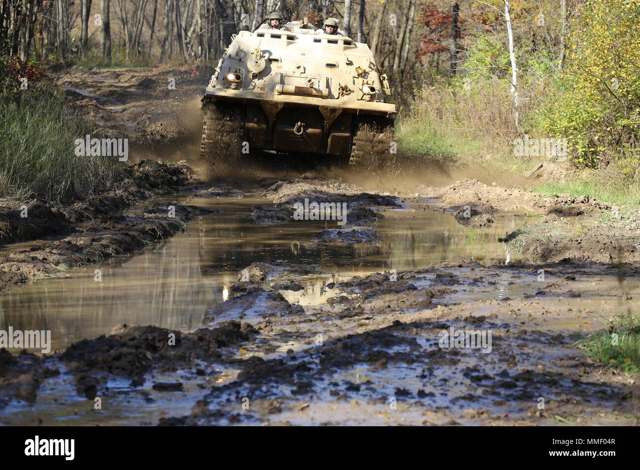 M88A1 Medium-Tracked Recovery Vehicle is an armored recovery vehicle developed for the United States Army to tow and repair disabled tracked vehicles, powered by a Continental AVDS-1790 diesel engine and equipped with a main winch rated at 60,000 pounds. On Oct. 20, 2017, it is driven during the Regional Training Site Maintenance Tracked-Vehicle Recovery Course at Fort McCoy, Wisconsin. The archival image documents hands-on vehicle recovery training on North Post. Stock Photo