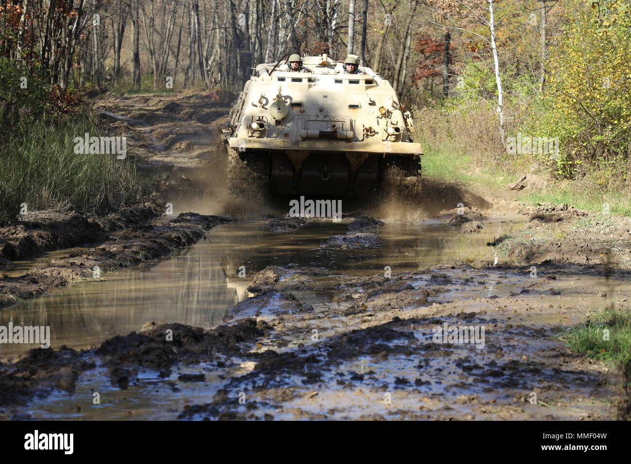 M88A1 Medium-Tracked Recovery Vehicle is an armored recovery vehicle developed for the United States Army to tow and repair disabled tracked vehicles, powered by a Continental AVDS-1790 diesel engine and equipped with a main winch rated at 60,000 pounds. On Oct. 20, 2017, it is driven during the Regional Training Site Maintenance Tracked-Vehicle Recovery Course at Fort McCoy, Wisconsin. The archival image documents hands-on vehicle recovery training on North Post. Stock Photo
