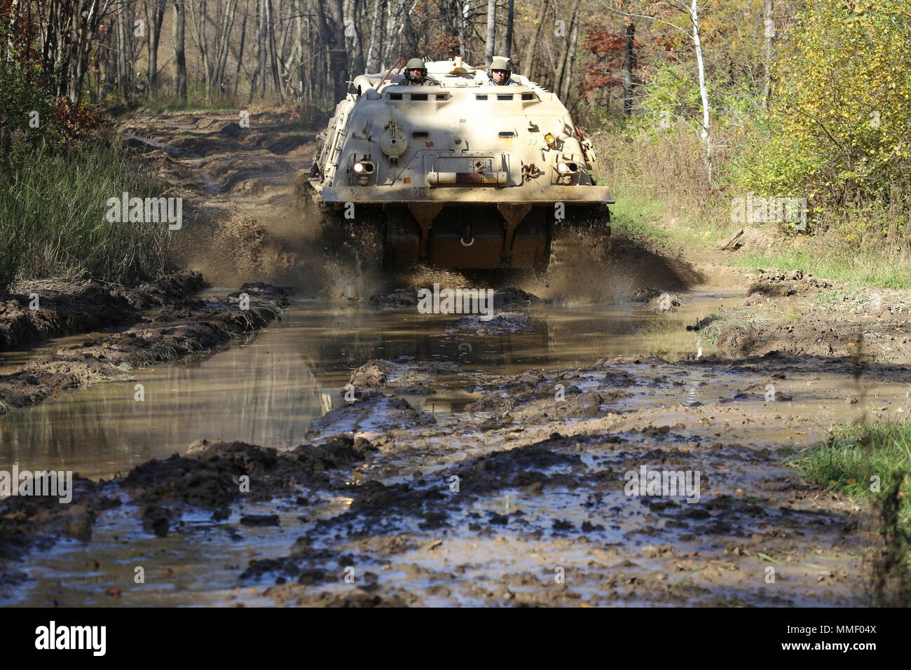 M88A1 Medium-Tracked Recovery Vehicle is an armored recovery vehicle developed for the United States Army to tow and repair disabled tracked vehicles, powered by a Continental AVDS-1790 diesel engine and equipped with a main winch rated at 60,000 pounds. On Oct. 20, 2017, it is driven during the Regional Training Site Maintenance Tracked-Vehicle Recovery Course at Fort McCoy, Wisconsin. The archival image documents hands-on vehicle recovery training on North Post. Stock Photo