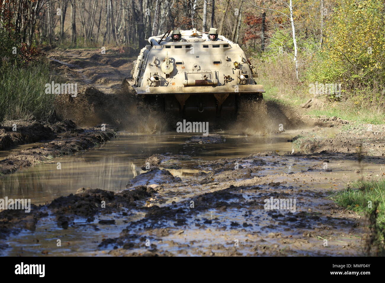 M88A1 Medium-Tracked Recovery Vehicle is an armored recovery vehicle developed for the United States Army to tow and repair disabled tracked vehicles, powered by a Continental AVDS-1790 diesel engine and equipped with a main winch rated at 60,000 pounds. On Oct. 20, 2017, it is driven during the Regional Training Site Maintenance Tracked-Vehicle Recovery Course at Fort McCoy, Wisconsin. The archival image documents hands-on vehicle recovery training on North Post. Stock Photo