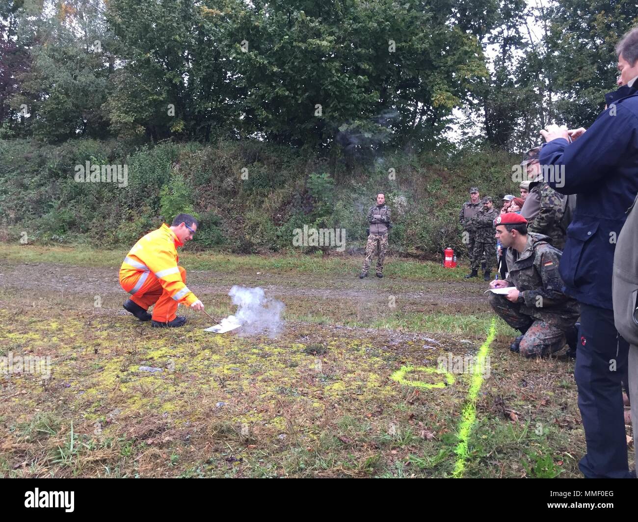 An ammunition technician from Armasuisse provides a pyrotechnics demonstration to military and civilian personnel of Organization for Security Cooperation in Europe member states during the Swiss Army Ammunition Site Assessment Course near Thun, Switzerland on September 27, 2017. Stock Photo