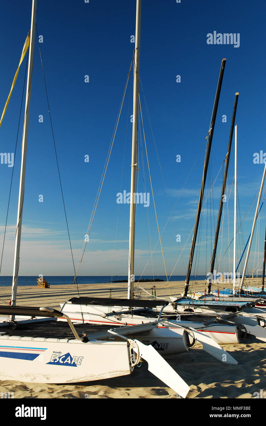Catamarans are lined up on the Jersey Shore, waiting for the next adventurer. Stock Photo