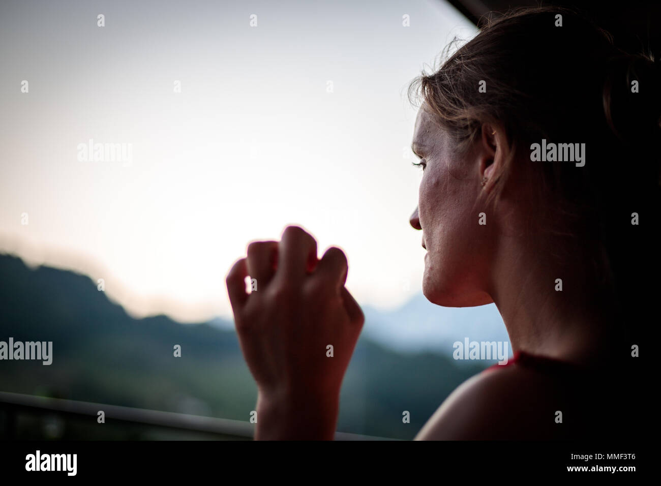 Pondering woman in thought Stock Photo