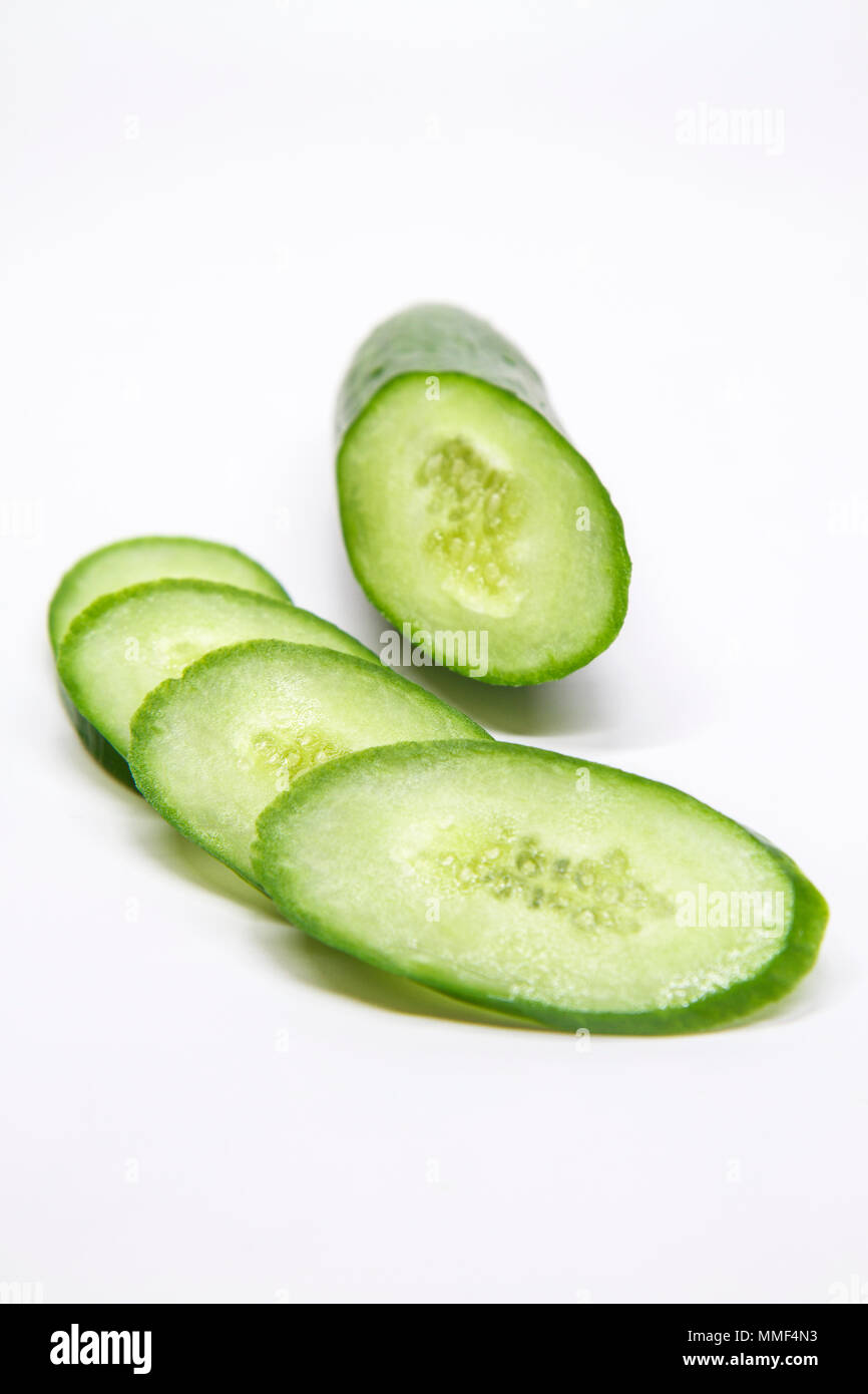 cucumber chopped ovals on a white background Stock Photo