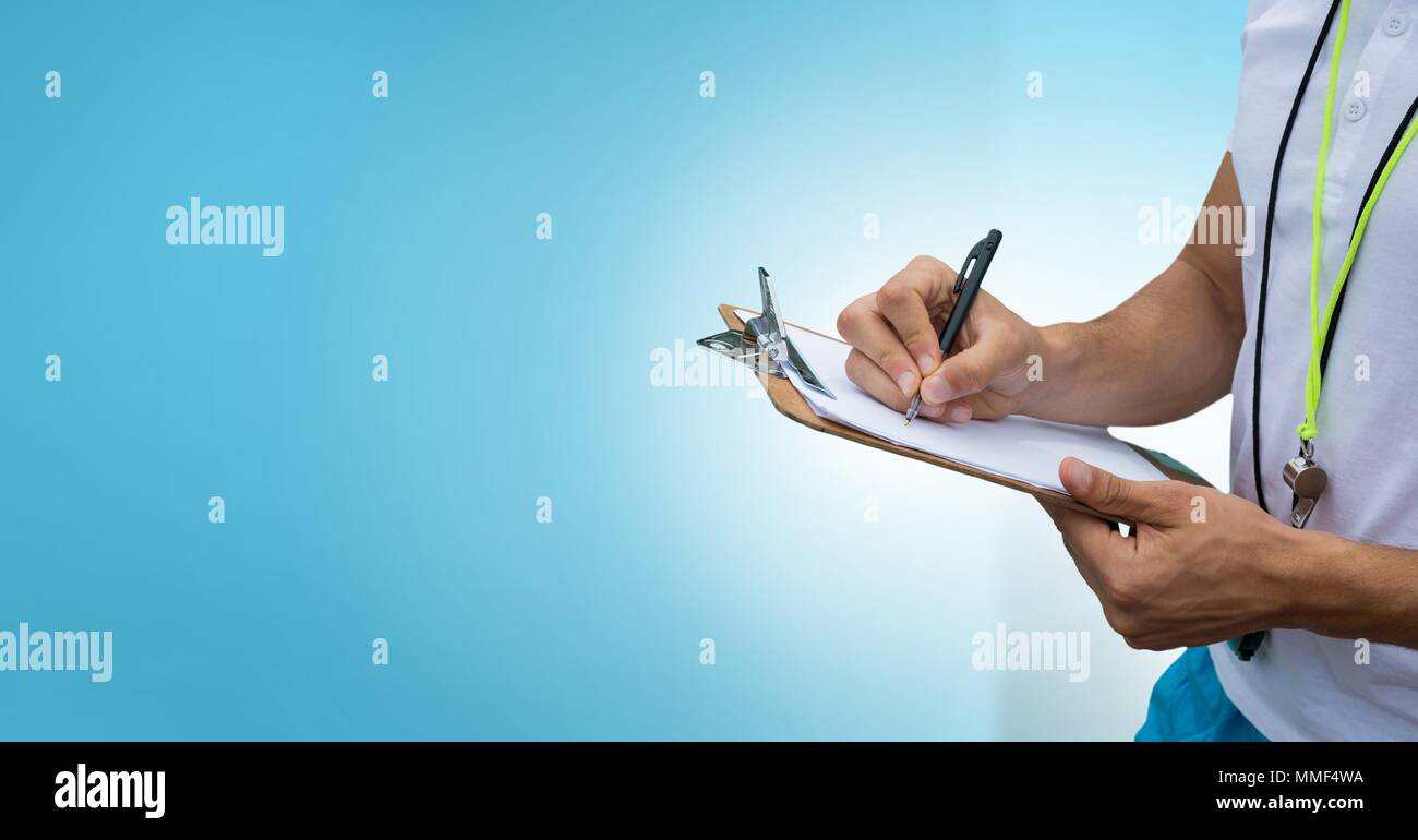 hands writing on chart paper with blank blue space Stock Photo