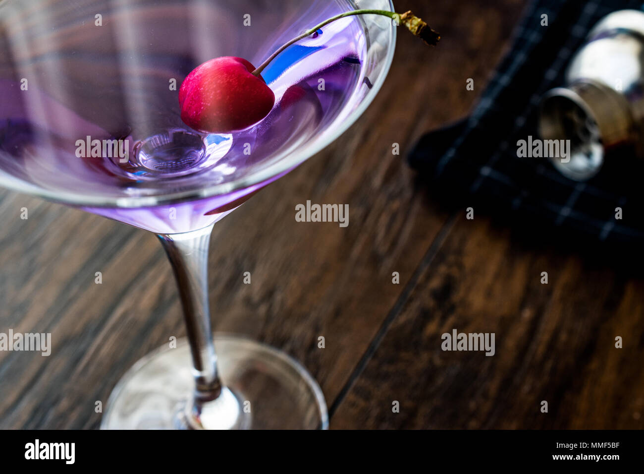 Blue Moon Cocktail with cherry on wooden surface. Luxury Concept Stock ...