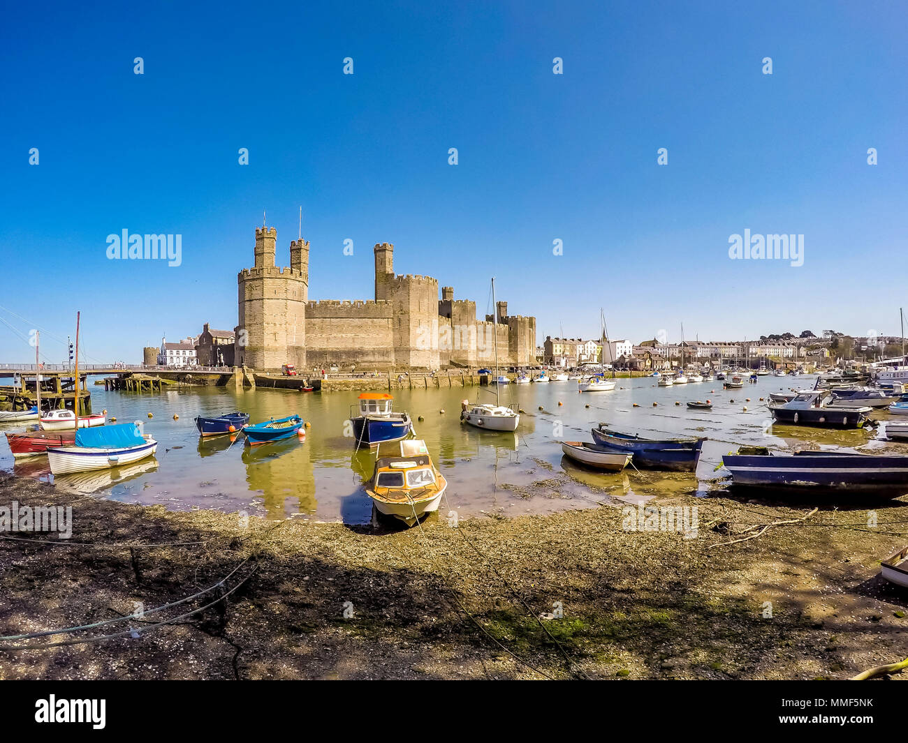 The skyline of Caernafon in Wales during low tide - United Kingdom. Stock Photo
