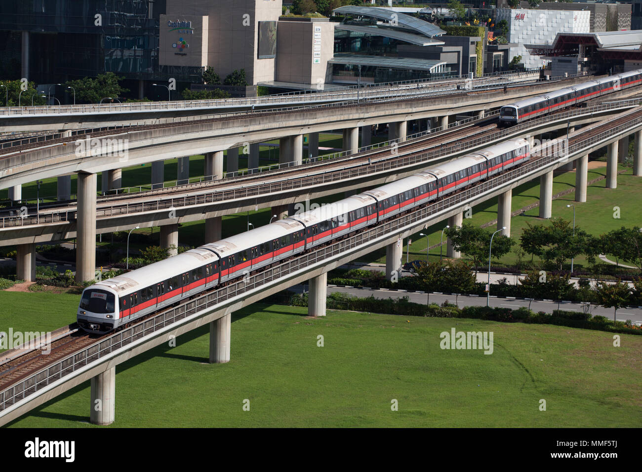 Two trains running on the train track at different direction, Singapore. Stock Photo