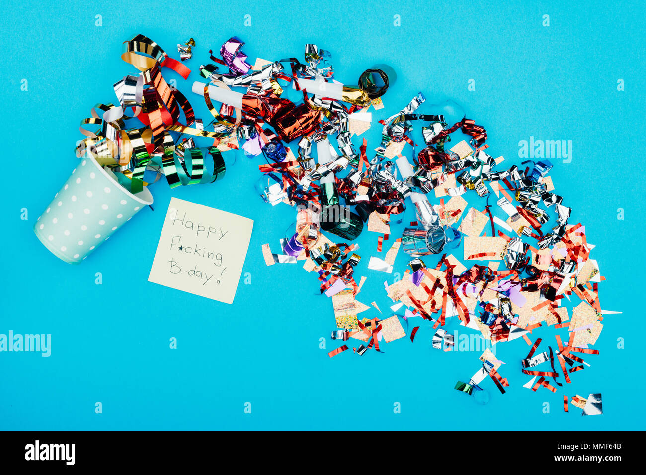 confetti pouring from paper cup Stock Photo - Alamy