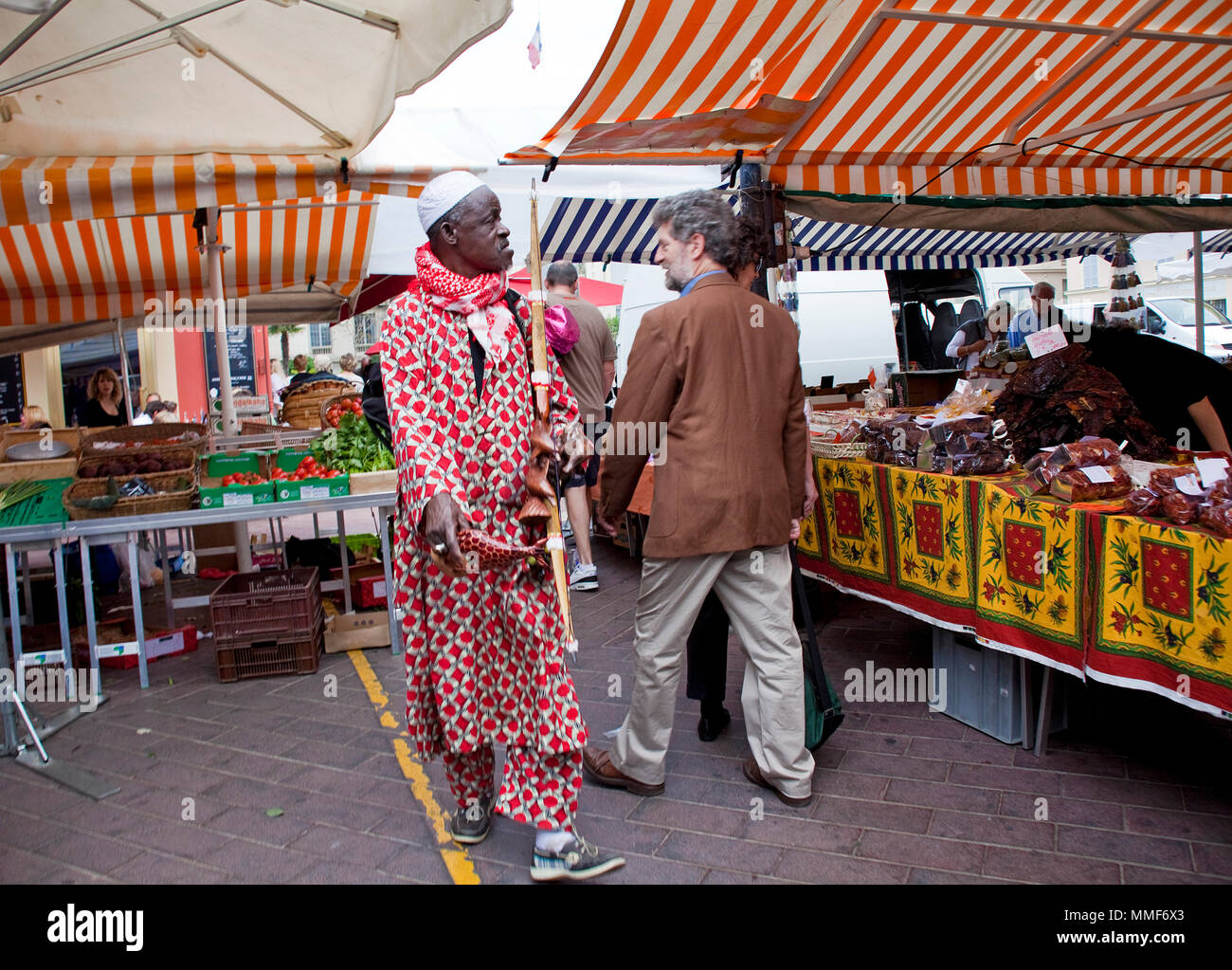 Dark-skinned souvenir seller at the market, place Cours Saleya, Nice, Côte d’Azur, Alpes-Maritimes, South France, France, Europe Stock Photo
