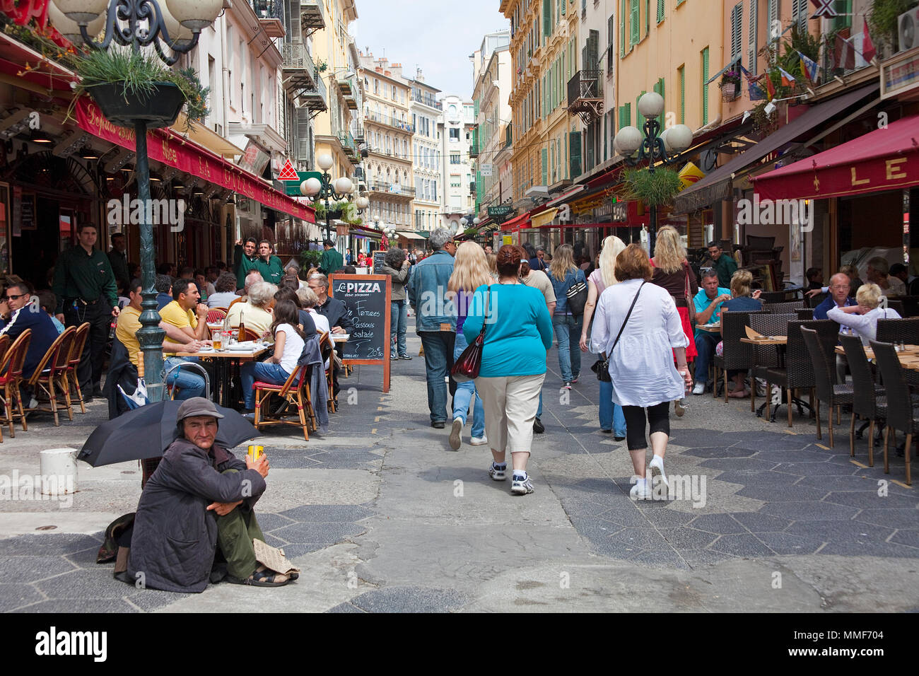Homeless person begs at pedestrian area, Nice, Côte d’Azur, Alpes-Maritimes, South France, France, Europe Stock Photo