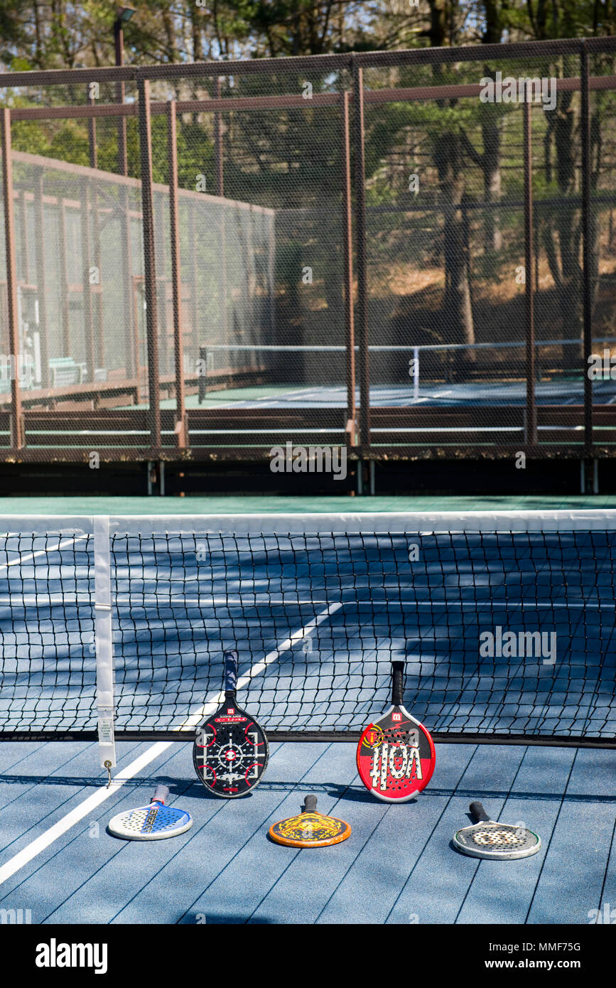 POUND RIDGE, NEW YORK-APRIL 18: Platform tennis paddles are seen at private club platform paddle court in Pound Ridge, New York on April 18, 2018. Stock Photo
