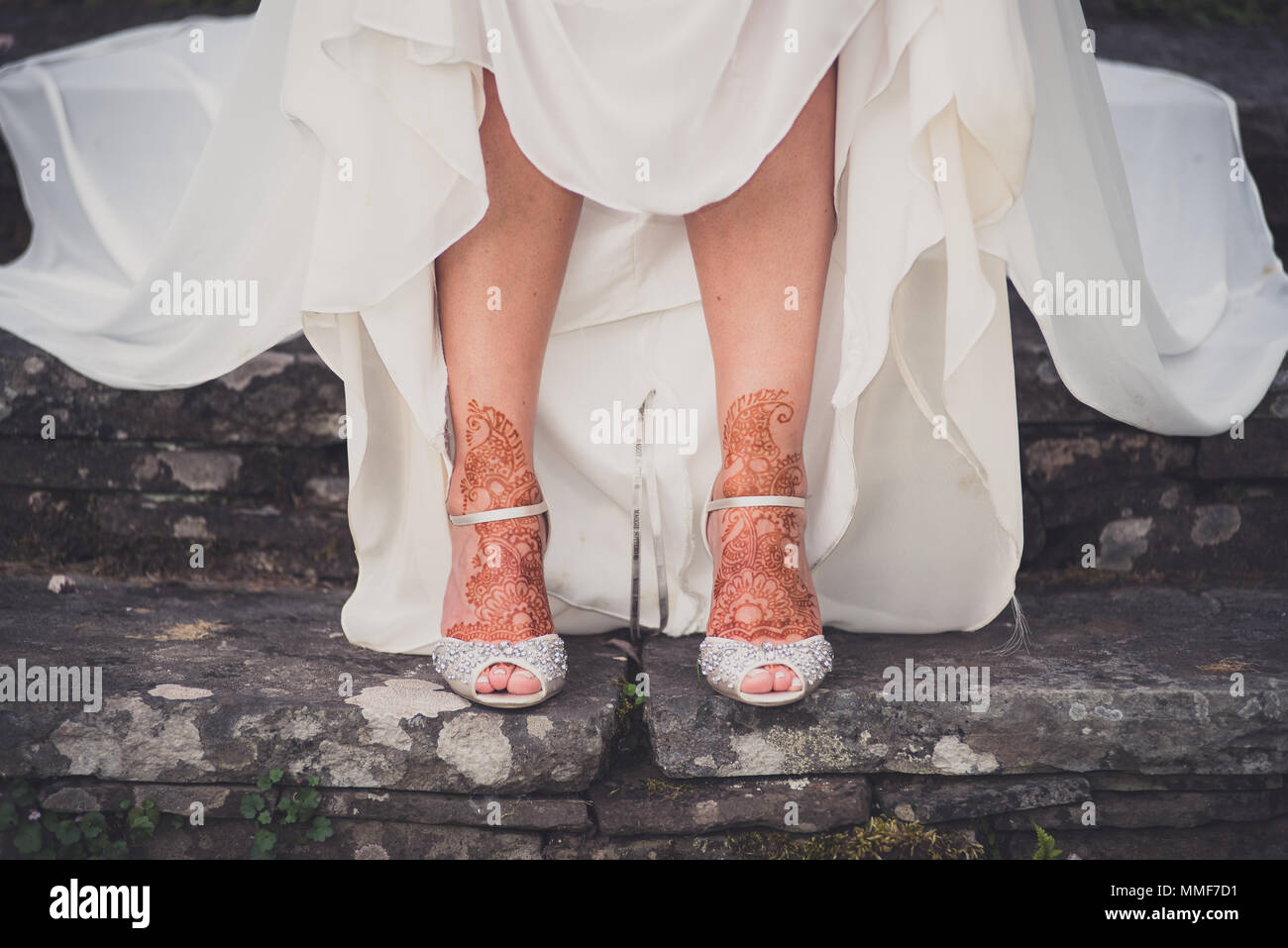 Pakistani Indian Bride Showing Henna Mehndi Art On Her Feet