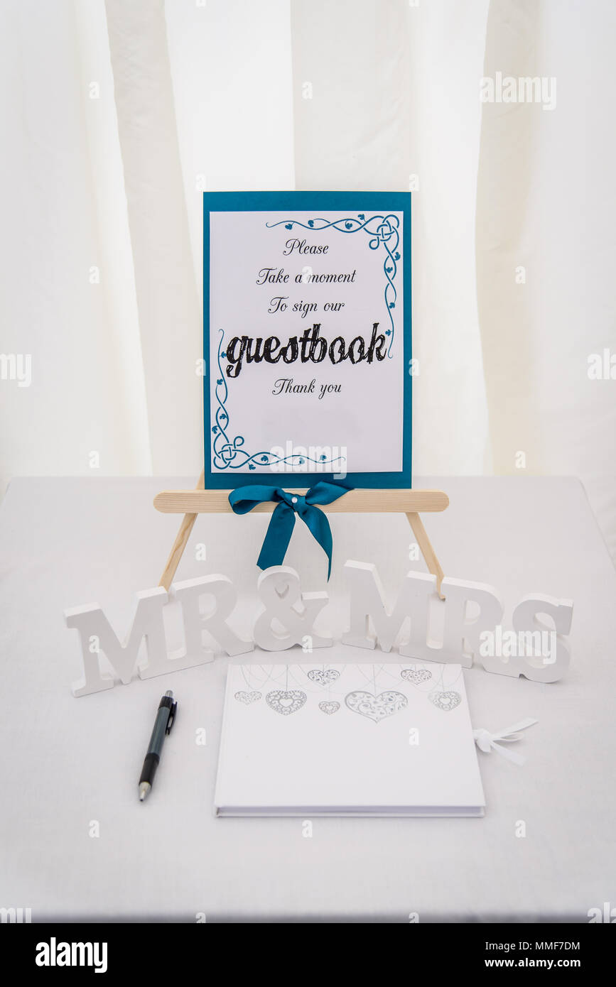 Wedding Guestbook on a table with Mr and Mrs Letters Stock Photo
