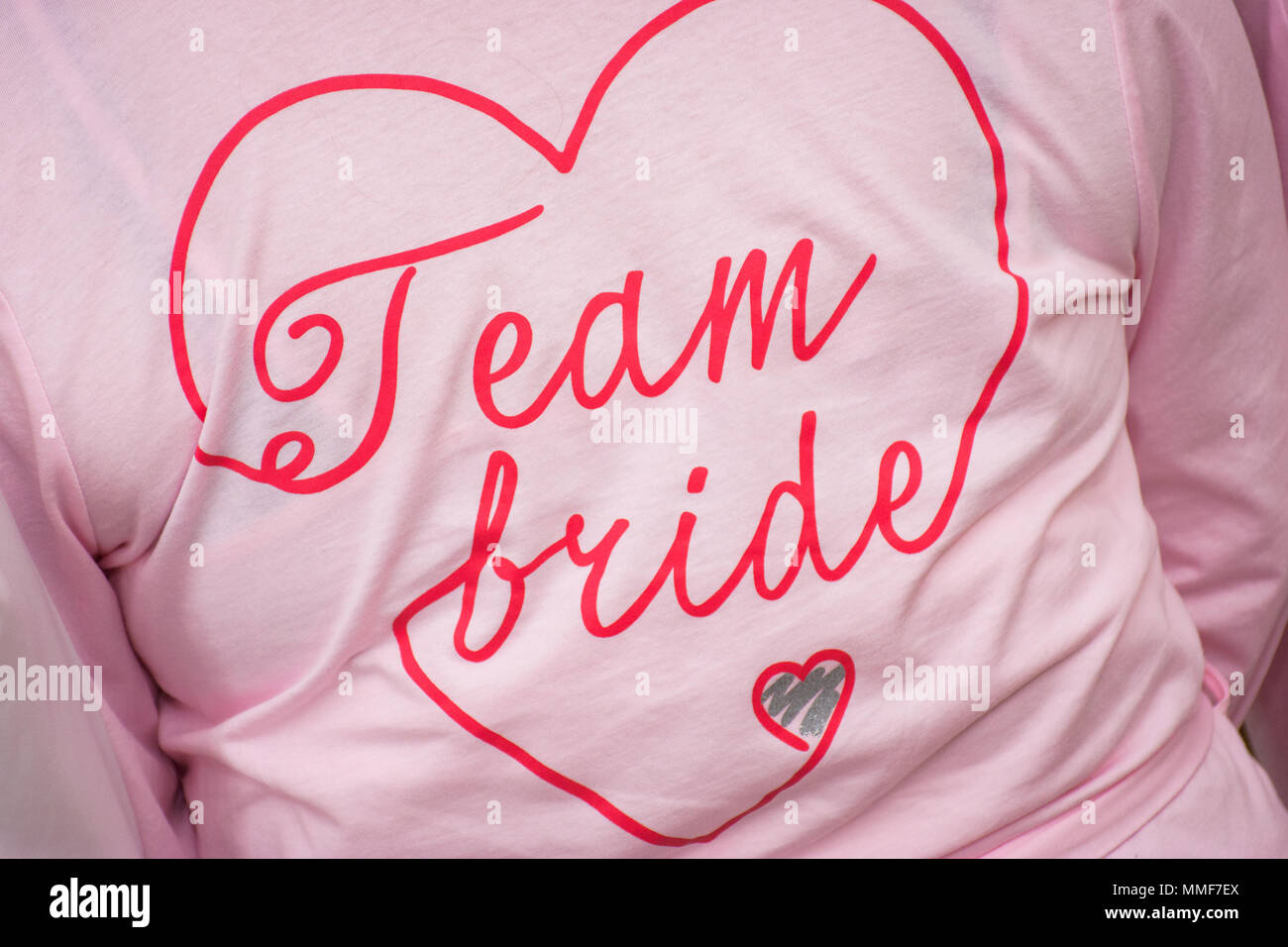 Bridesmaid with the words Team Bride, printed on the back of her