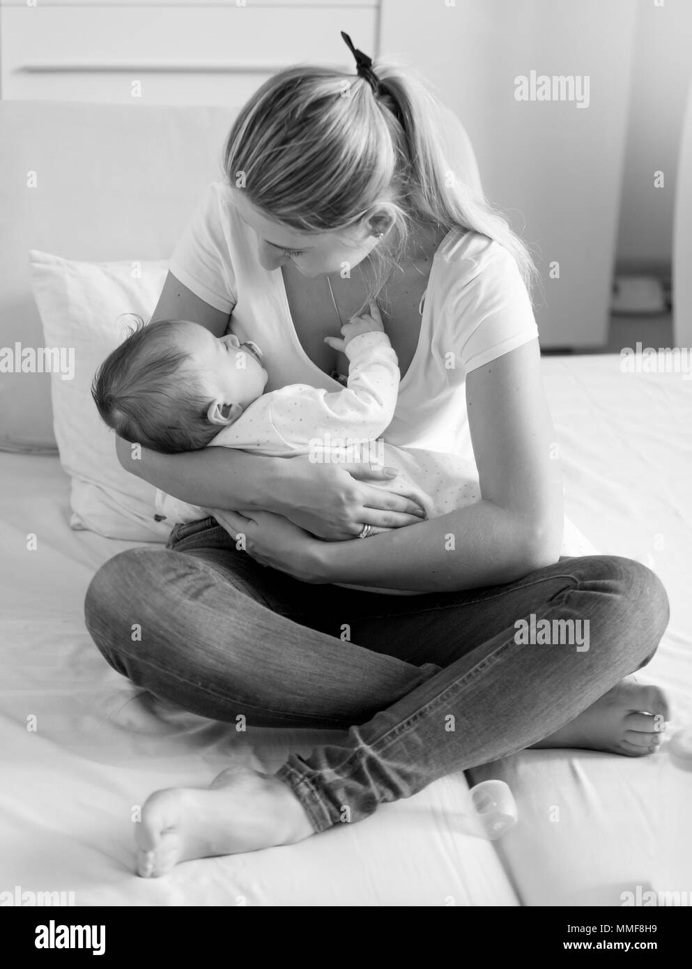Black baby sleeping on bed hi-res stock photography and images - Alamy