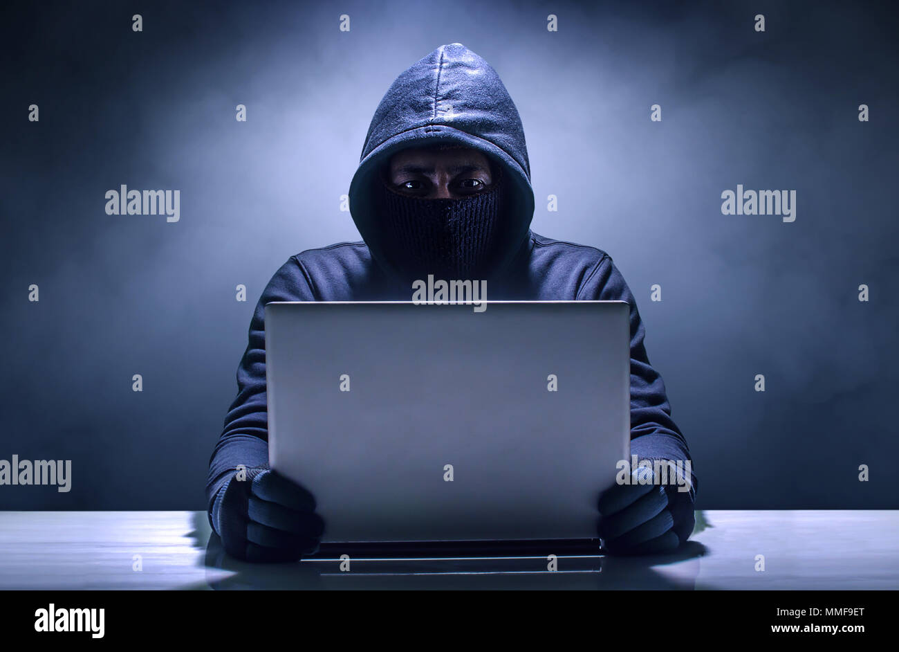 Hacker in front of his computer. Stock Photo