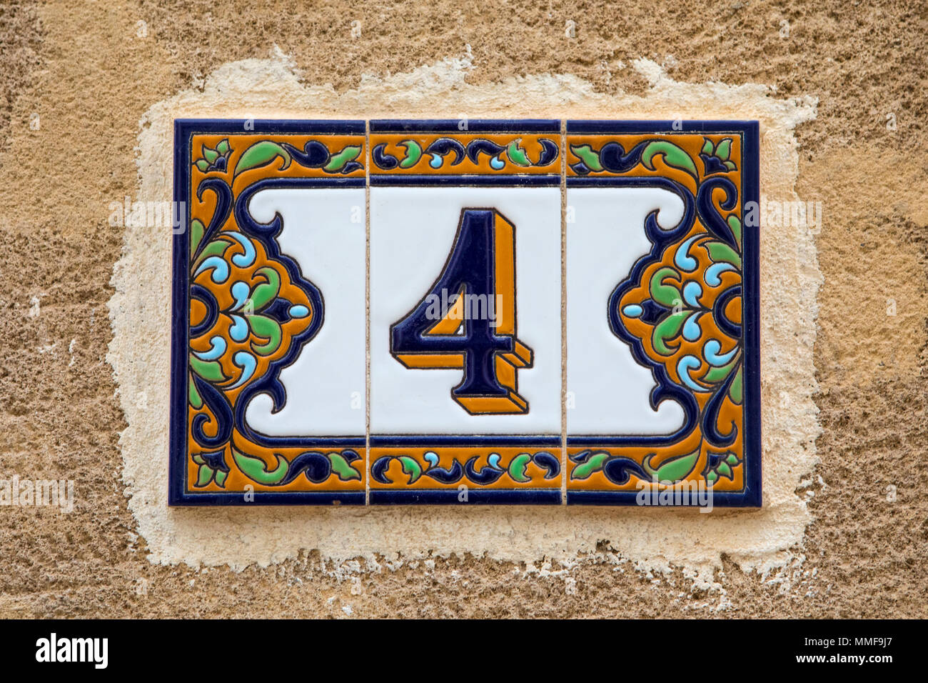 A Tiled Number 4 On A Wall Stock Photo - Alamy