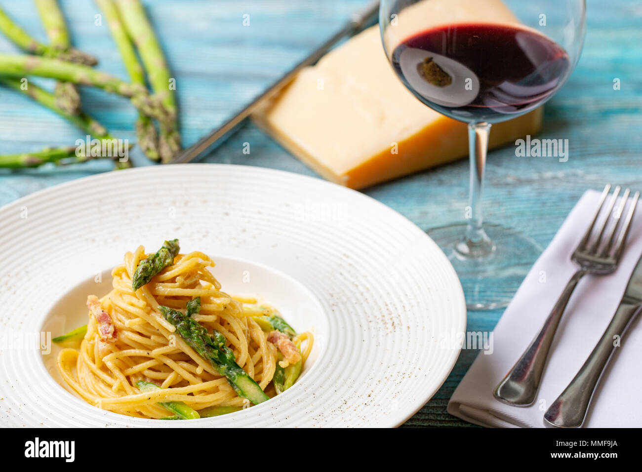 pasta carbonara with asparagus. restaurant feed. laying Stock Photo Alamy