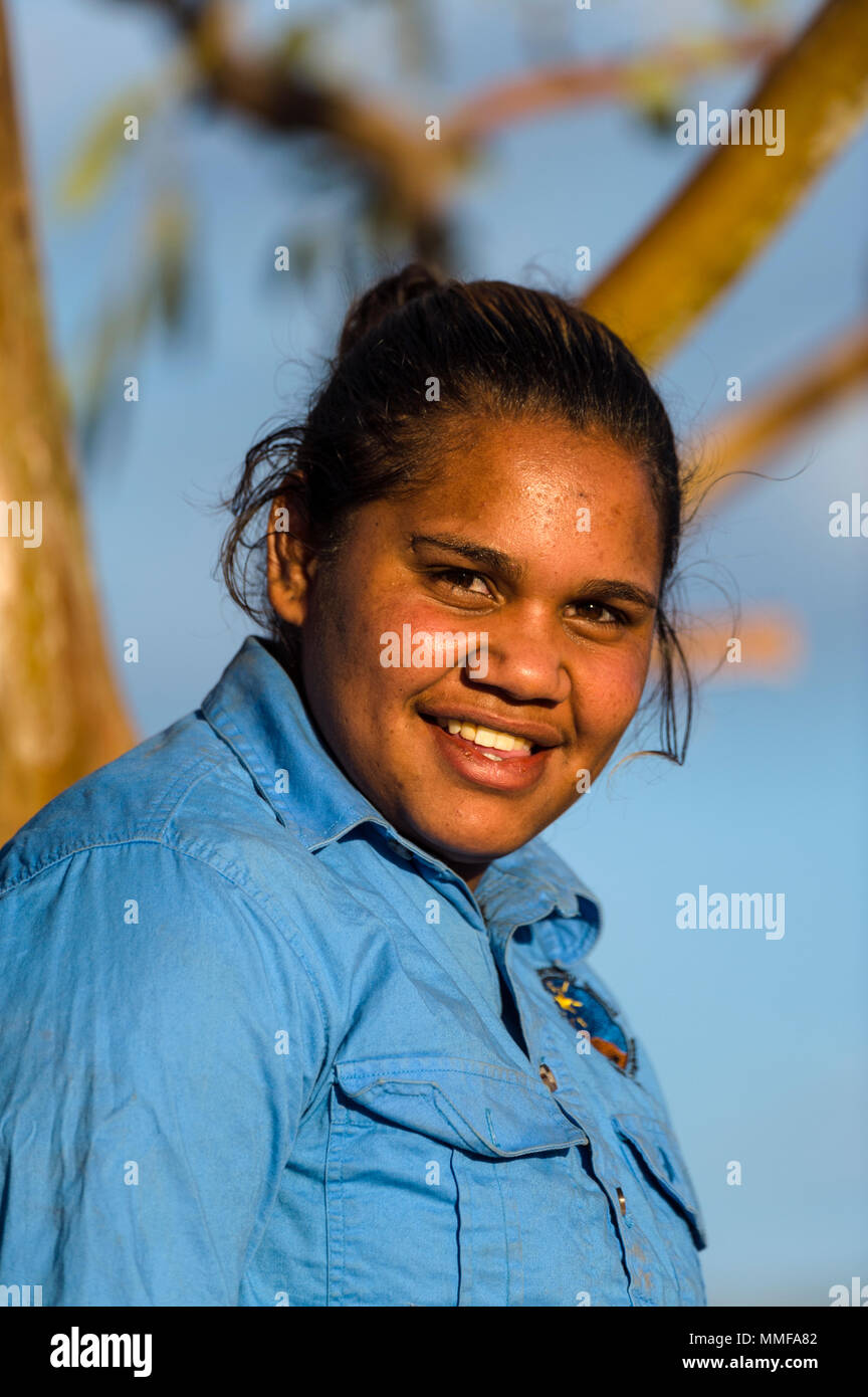 An aboriginal student learns about rescued wild horses known as a brumby's on an outback station. Stock Photo