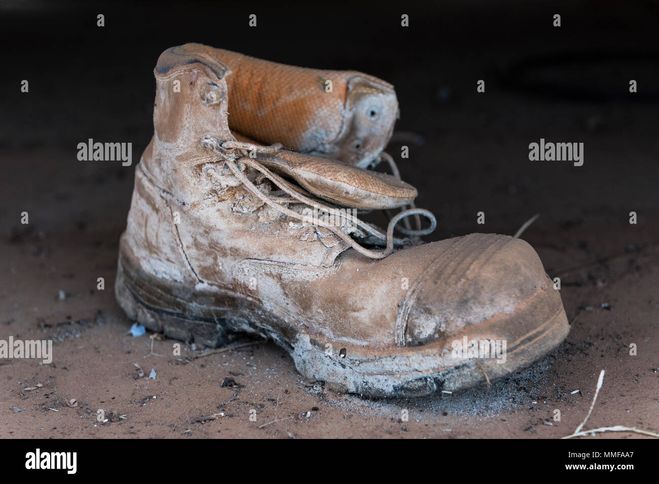 An old leather working booted abandoned on a bus. Stock Photo