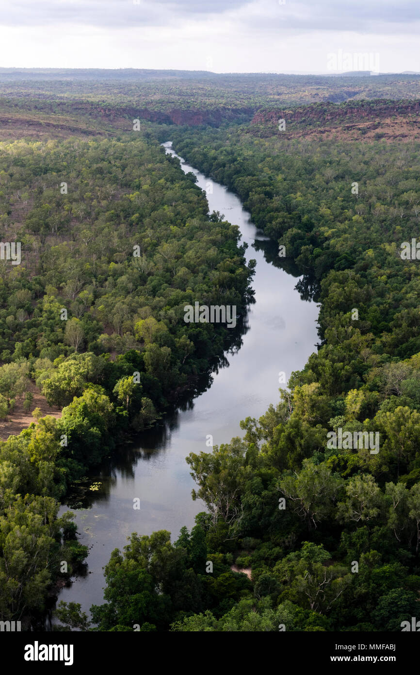 A forest-lined river winds it's way through a sandstone gorge on a remote outback cattle station. Stock Photo