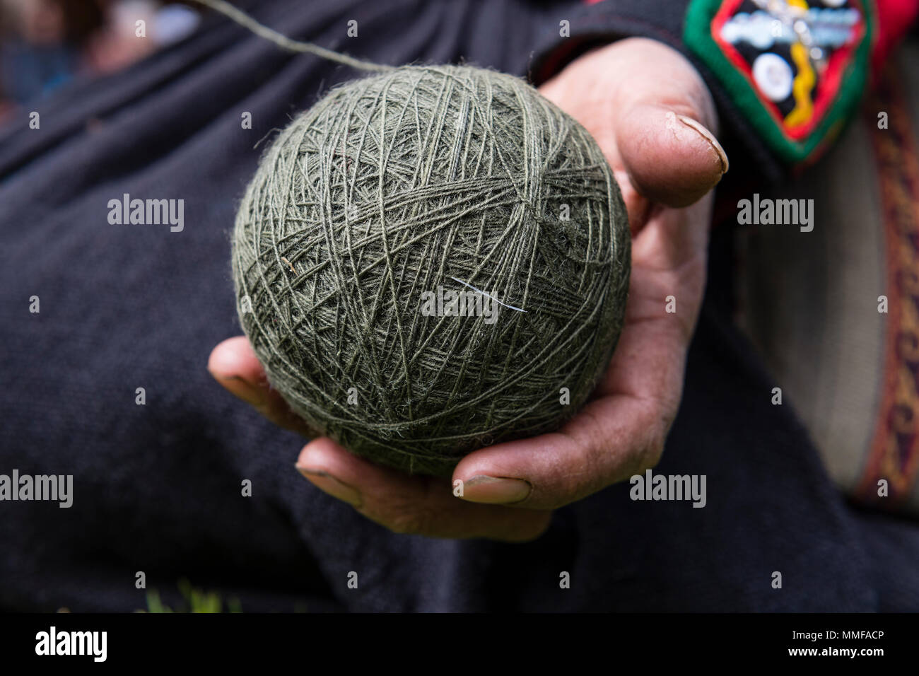 A ball of green Llama wool ready for weaving. Stock Photo