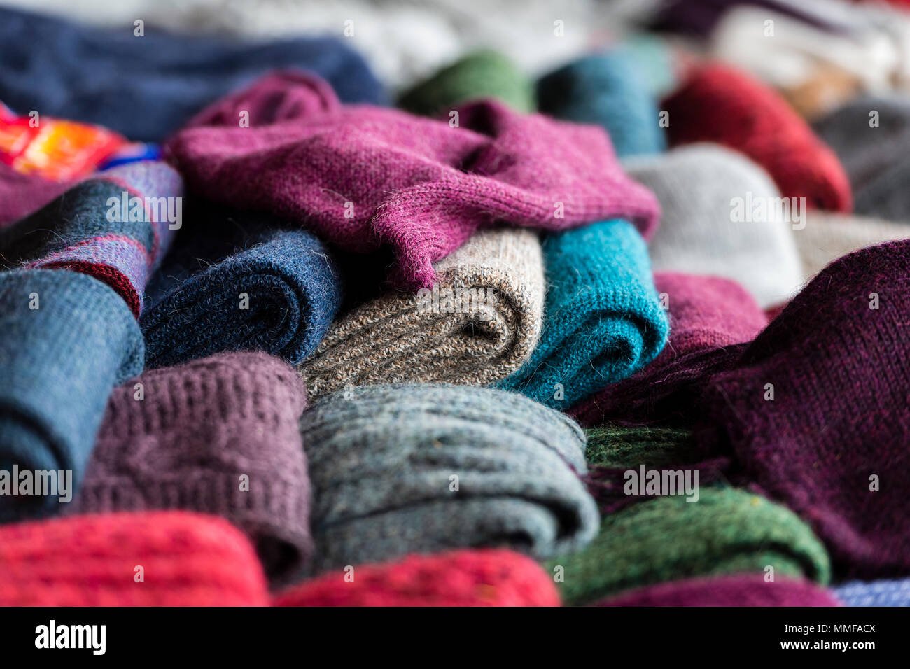 Colorful Llama wool scarfs for sale in an Andean village. Stock Photo