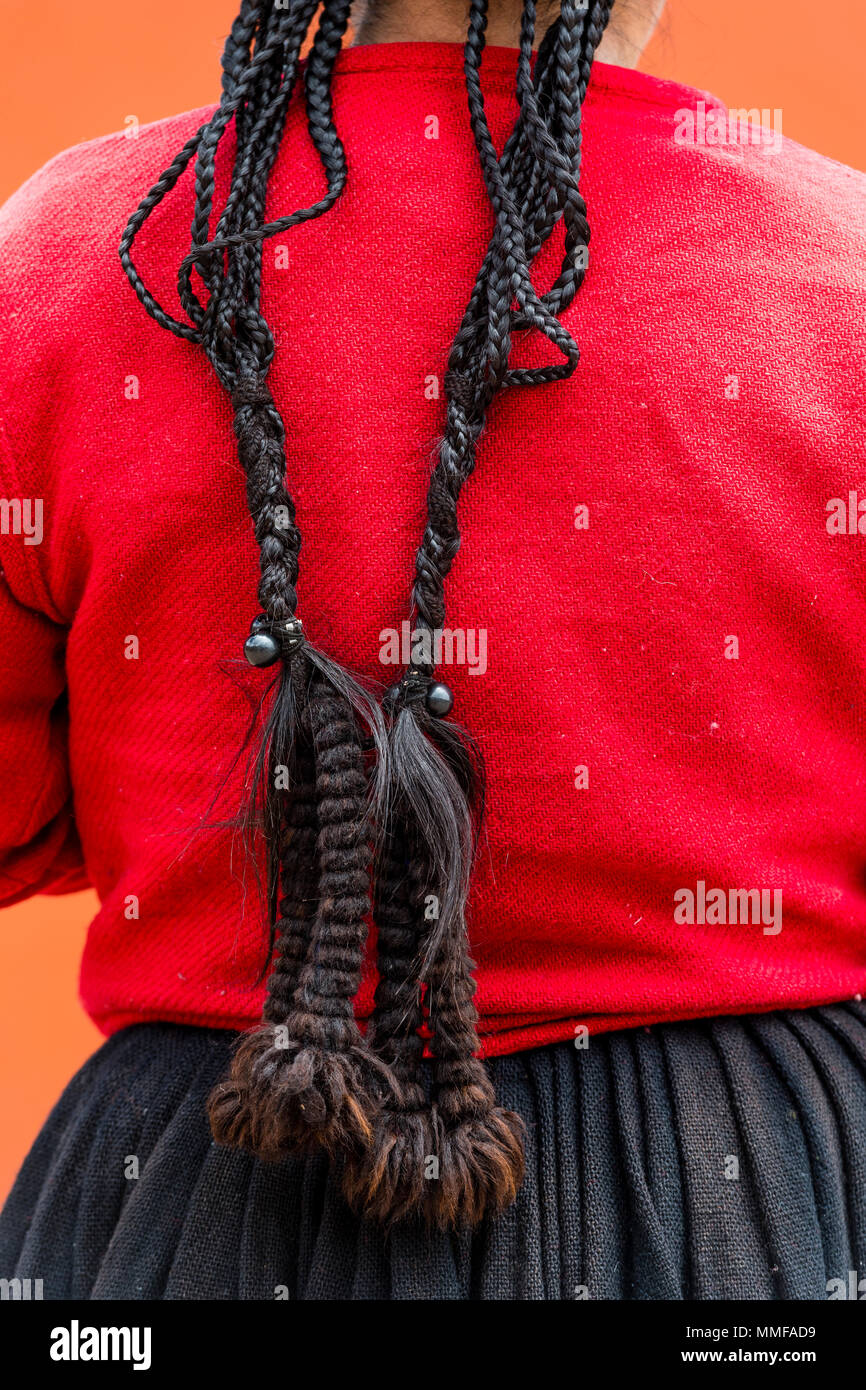 The long hair braids of a Quechua woman. Stock Photo