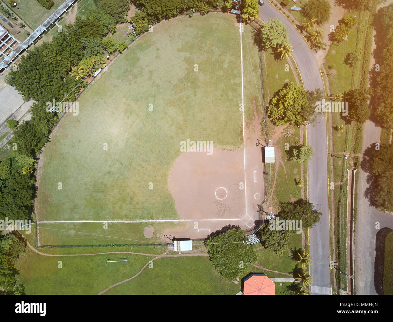 Green baseball field aerial drone view on sunny light day Stock Photo