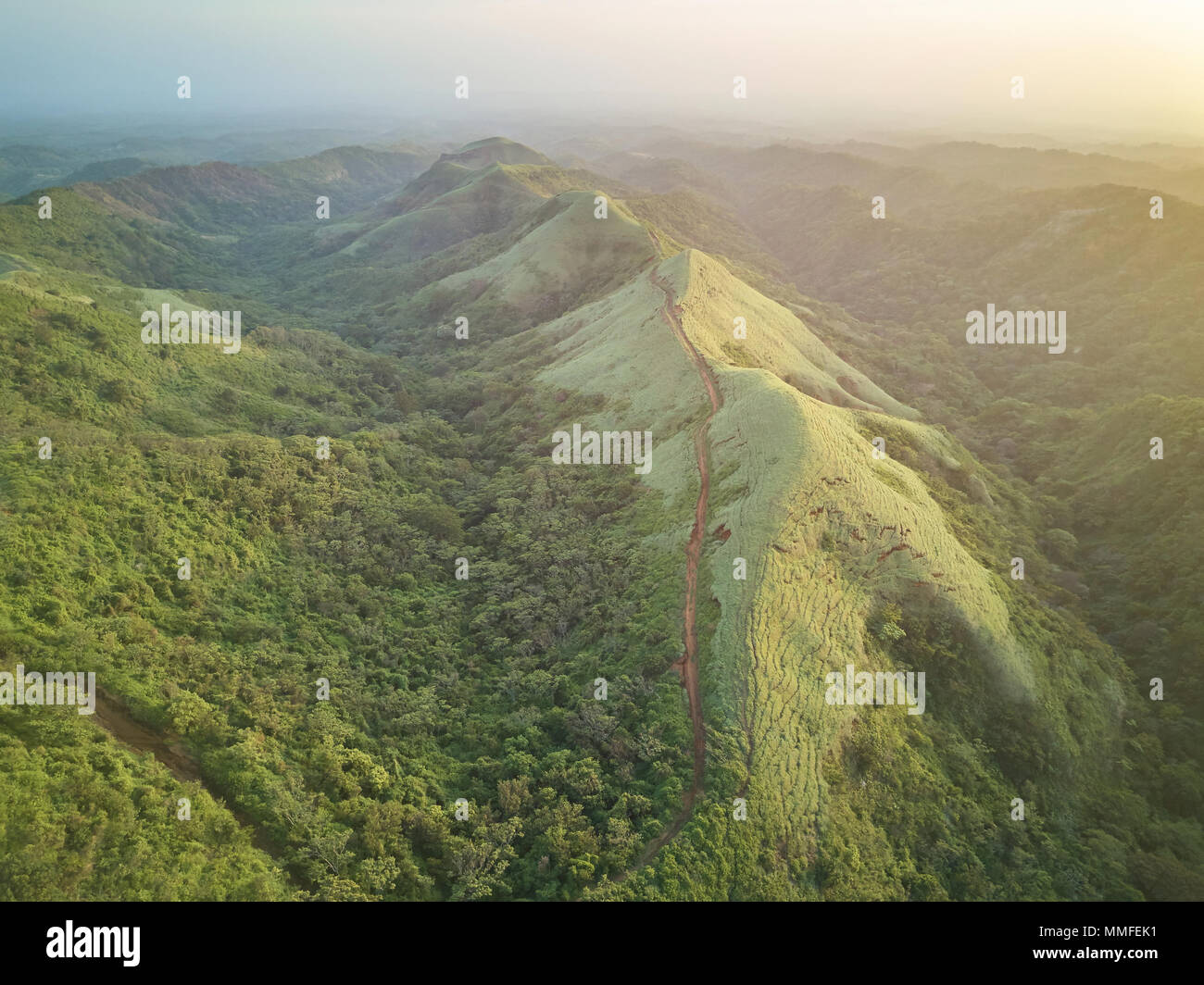 Scenic aerial view on green hills on sunset light time Stock Photo
