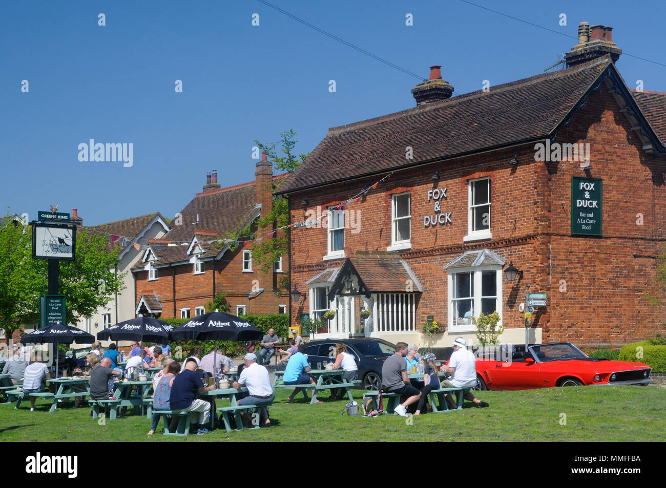 Bank Holiday weekend customers enjoy the weather outside the Fox & Duck