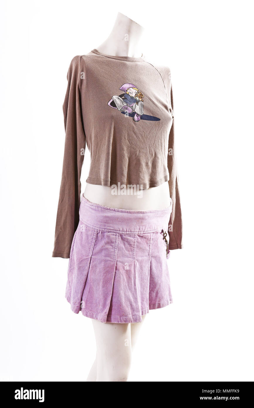 Short shirt purple skirt on mannequin full body shop display. Woman