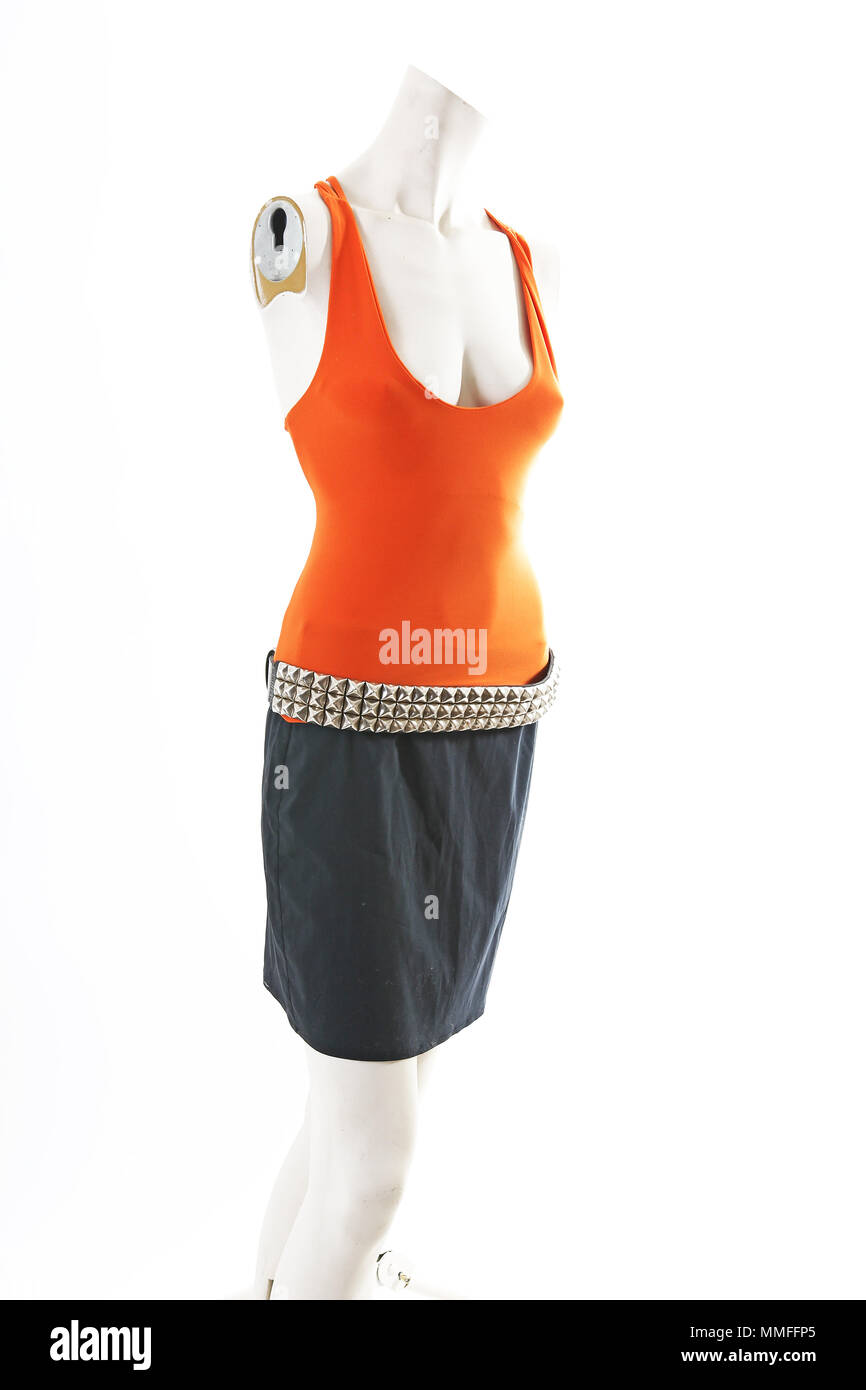 Orange top and black skirt on mannequin full body shop display. Woman
